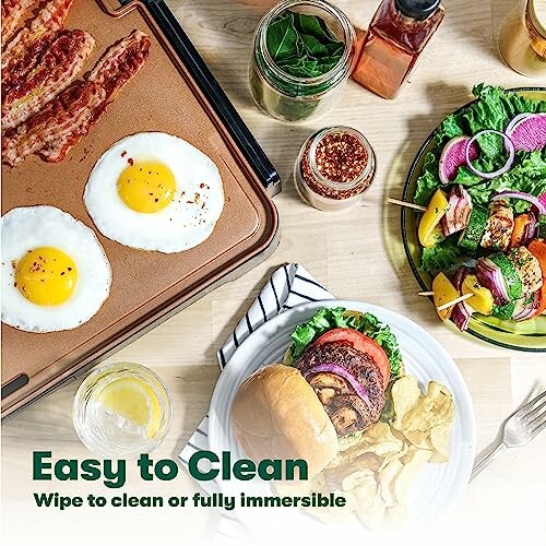 Breakfast with eggs, bacon, burger, and skewers on a wooden table.