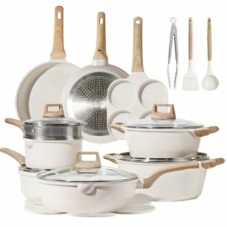 Ceramic cookware set with pots, pans, and utensils.