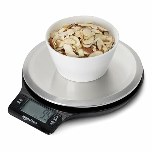 Digital kitchen scale with a bowl of sliced almonds.
