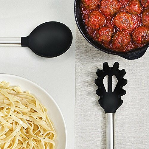 Pasta and meatballs with kitchen utensils.