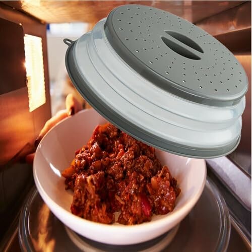 Microwave food cover over a dish in a microwave.