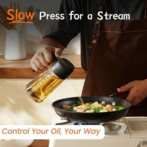 Person pouring oil from a dispenser into a frying pan on a stove.