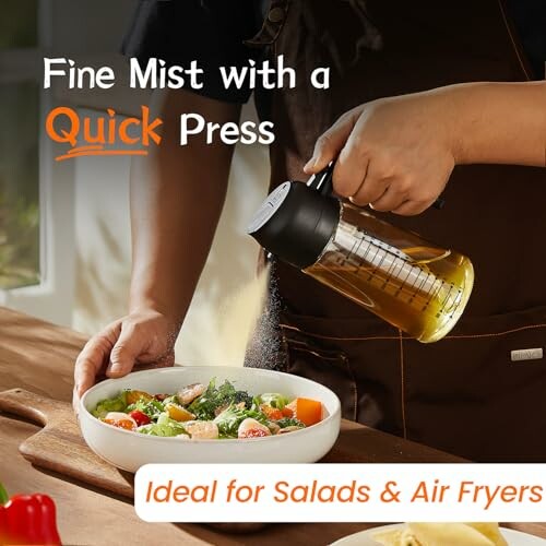 Person using oil sprayer on salad with text 'Fine Mist with a Quick Press'.