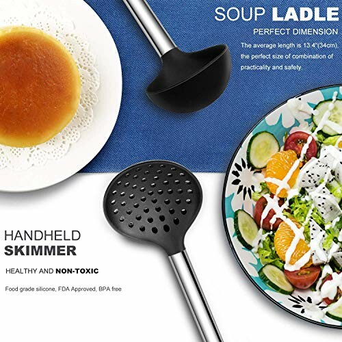 Soup ladle and handheld skimmer on table with salad and bread.