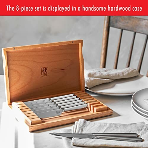 8-piece steak knife set in wooden case on dining table.